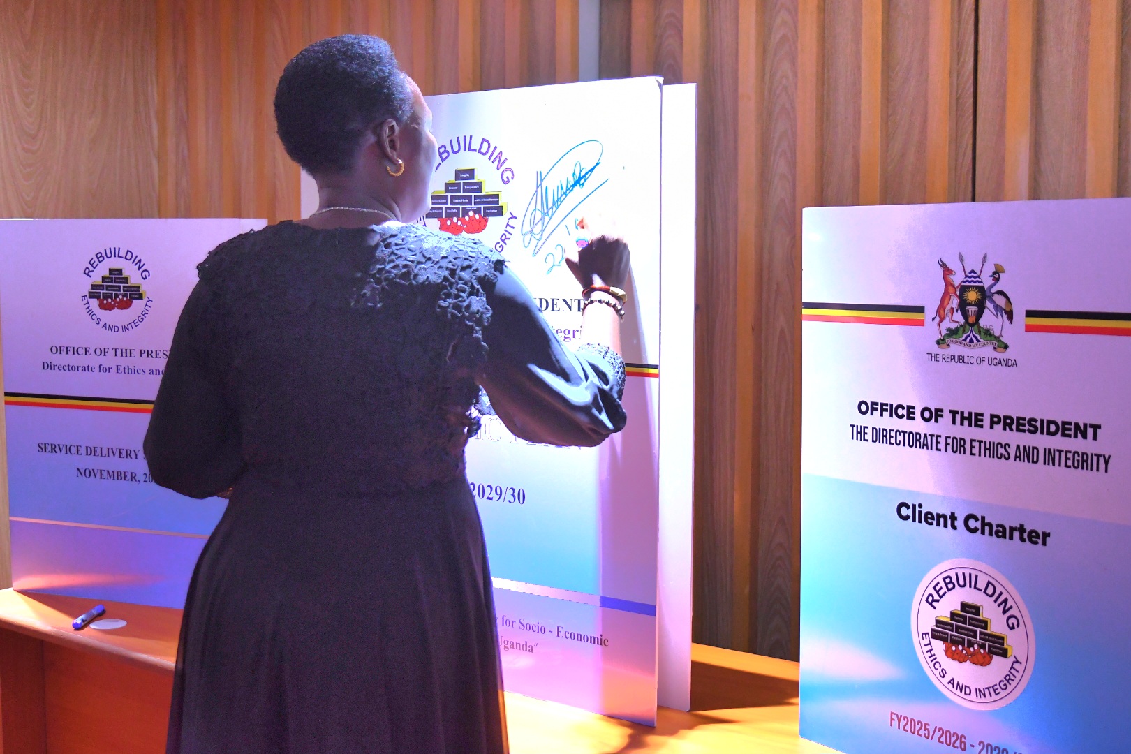 CIG and DEI display signed copy of the MOU